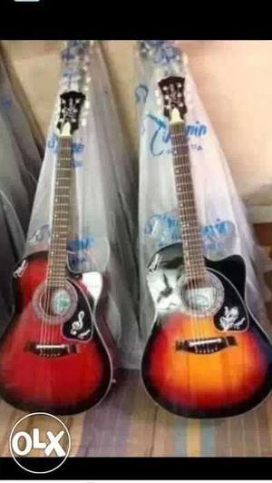 Two Redburst And Sunburst Cutaway Acoustic Guitars
