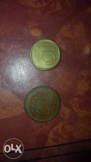 Two Round Gold-colored And Copper-colored Coins