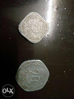 Two Silver-colored 5 And 20 Indian Paise Coins
