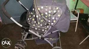 Baby's Gray And Green Polka Dot Stroller