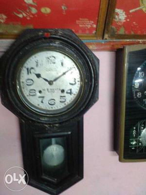 Black And Gray Pendulum Clock