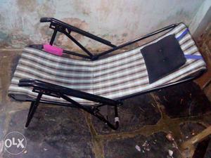 Black Steel Framed Brown And White Plaid Patio Lounge Chair