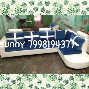 Blue And White Sectional Couch With Throw Pillows Screenshot