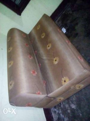 Brown And Yellow Floral Armless Sofa