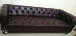Four (4) seater leather sofa, bark brown in very