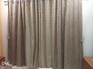 Full size branded curtains in brown colour
