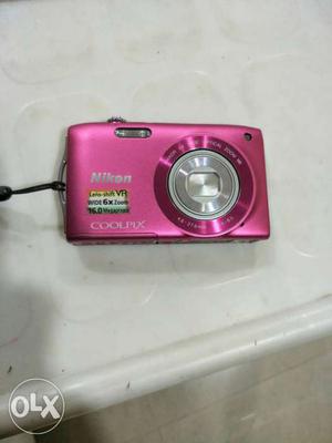 Pink Nikon Coolpix Point-and-shoot Camera 16 mega pixels