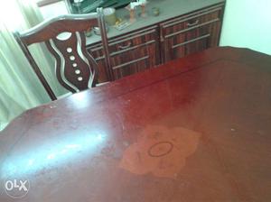Smooth surfaced, shining dining table, unused.