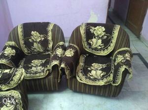 Two Brown And White Floral Armchairs