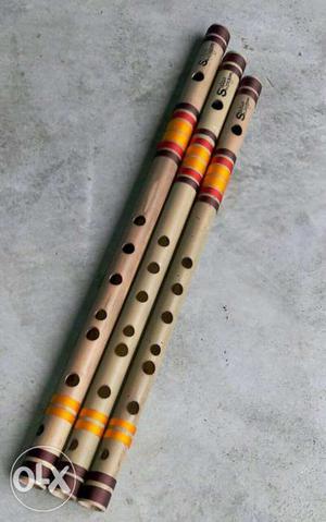 Two Brown Wooden Flutes