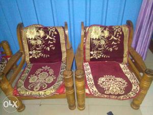 Two Brown Wooden Framed Red Suede Armchairs