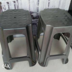 Two Gray Plastic Chairs