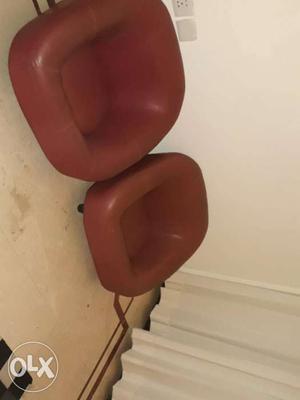 Two dark maroon Leather Sofa Chairs