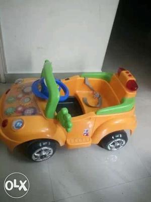 Yellow And Green Plastic Ride On Toy Car