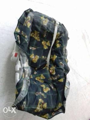 Baby's Black, Yellow, And Green Car Seat Carrier
