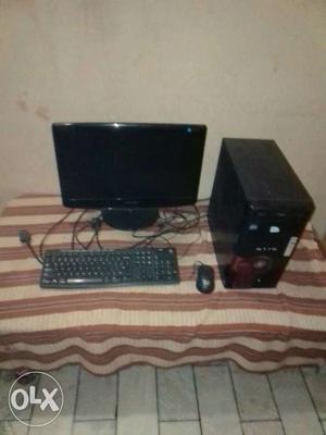 Computer Monitor, Keyboard, Mouse, And Tower