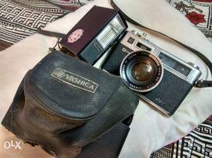 Grey And Black Yashica Flash Camera With Case