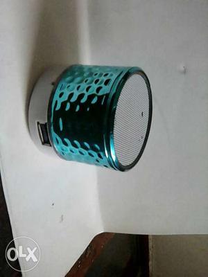 Round White And Teal Portable Speaker