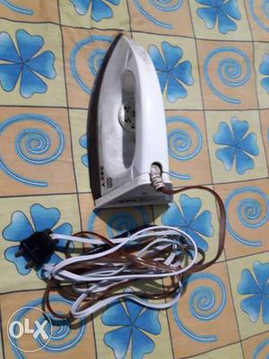 White And Brown Clothes Iron