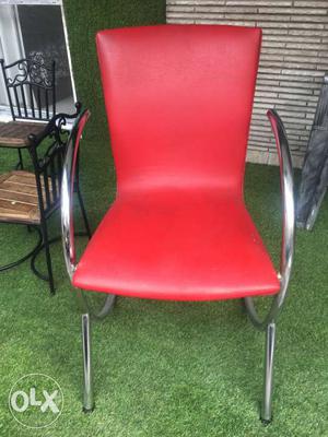 2 red colour leather chairs for Rs. . price negotiable.