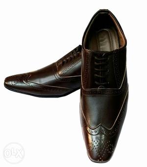 A brand new pairs of brown brogue shoes