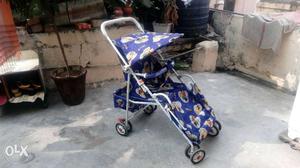 Baby's Blue And White Canopy Stroller