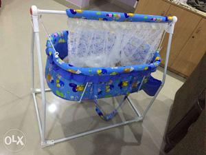 Blue, White, And Yellow Mobile Swing