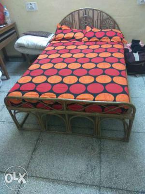 Cane wood queen size bed in good condition.