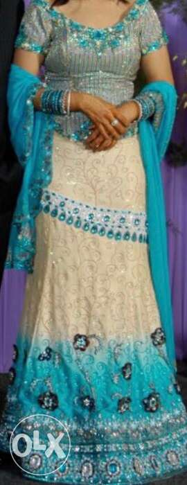 Excellent lehenga beige and blue colour for bride