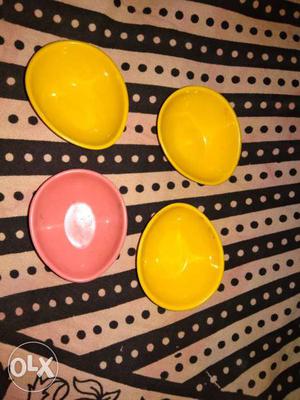 Four Yellow And Pink Ceramic Bowls