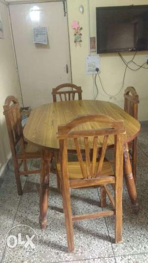 Four seater oval shaped purely wooden dining