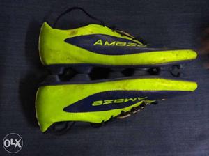 Green-and-black Amaze Leather Cleats