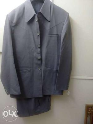 Grey dsgnner suit.used once.for 6 ft. height.
