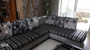 L shaped sofa in black grey n white. total