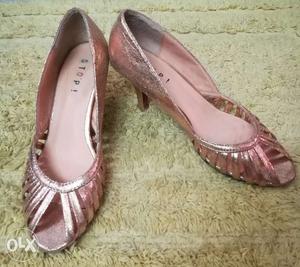 Less used party wear heels in rose gold color,