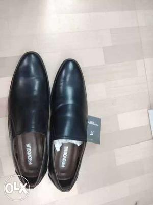 Pair Of Black Provogue Leather Dress Shoes