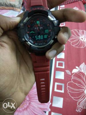 Round Black Digital Watch With Red Strap