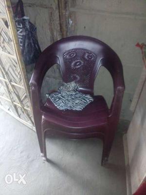 Two Maroon Monobloc Chairs
