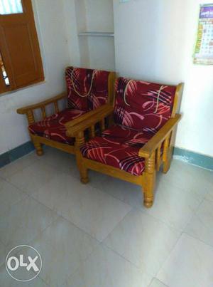 Two Red Padded Brown Wooden Sofa Chairs