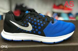 Unpaired Black, White And Blue Nike Sneakers