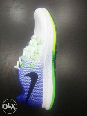 White, Blue, And Green Nike Low-top Sneaker Shoe