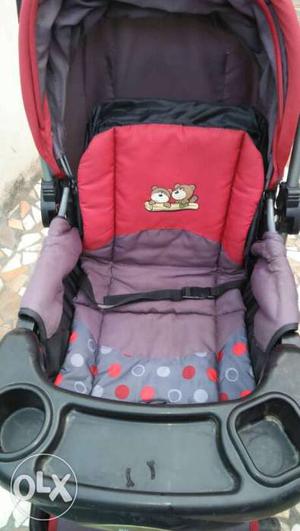 Baby's Pink And Gray Stroller