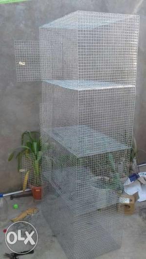 Four Gray Metal Pet Cages