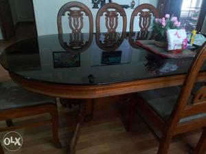 Oval Brown Wooden Dining Table With Chairs