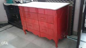 Red And White cabinet with two big drawers