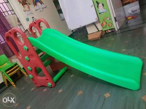 Toddler's Red And Green Plastic Slide