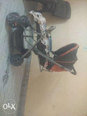 Baby's Red And Black Pram Stroller
