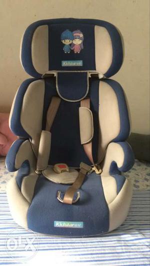 Blue And Beige Car Booster Seat