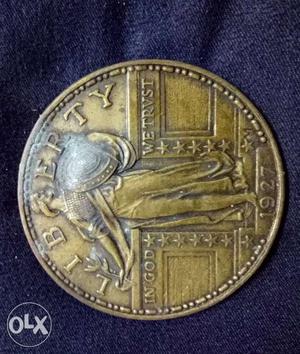 Gold-colored Liberty Coin