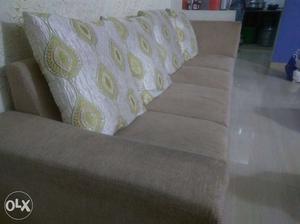 Gray 4-seat Sofa With White Throw Pillows